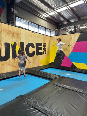 Child participant and support worker at Bounce, demonstrating person centred disability care and NDI