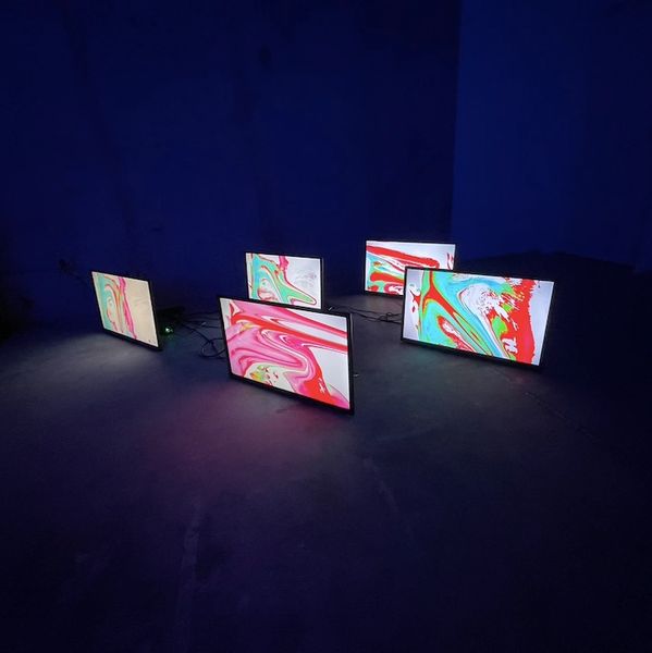 Installation of Marco Caridad’s video performance “Desigual Makeup” displayed on five TV monitors at DORCAM.
