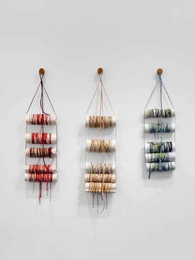 Portadas sin juicios by Marco Caridad, 2024 — assemblage of book covers, burnt pages