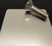 A nail is placed on the white table