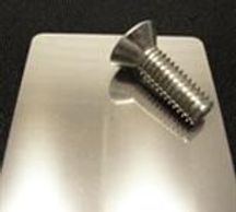 A steel screw on the polish table