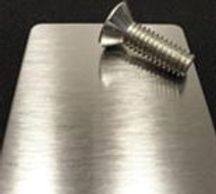 A small steel screw on the edge of the table