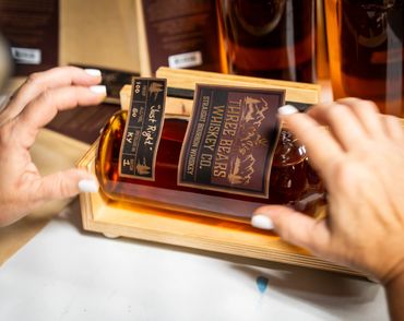 Mama Bear placing the stickers on the "Just Right" bottle