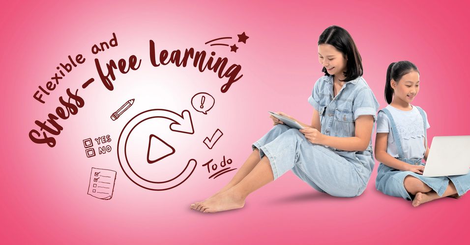 Black pencils in a gray holder next to a stack of white magazines with a camera in the background.