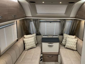 Seating with blinds, converts into double bed