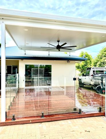 Out door patio Kewarra Beach.
Patio fly over roof, decking, glass pool fencing and sliding door.