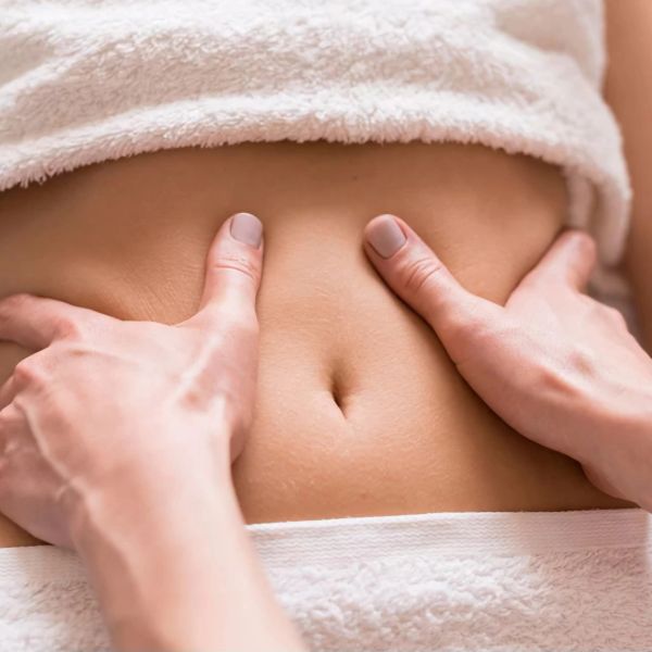 Person receiving a stomach massage.