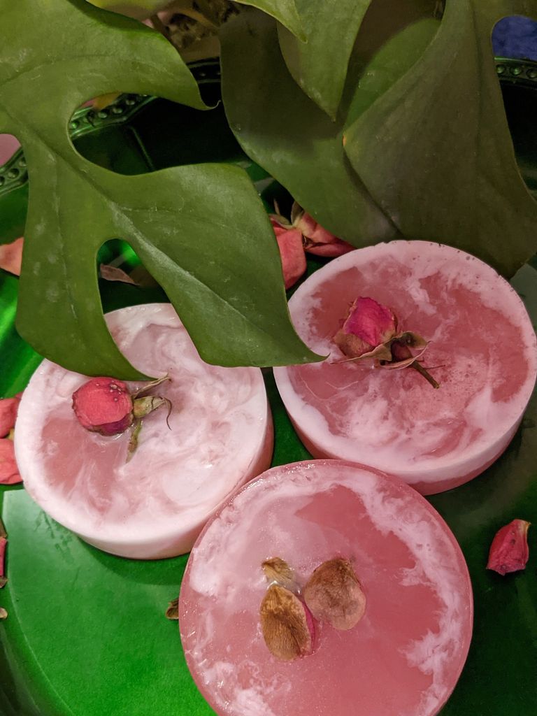 Pink glycerin soap swirled white w/ shea butter oatmeal. Marbled, swirl look. Rose scented with bud