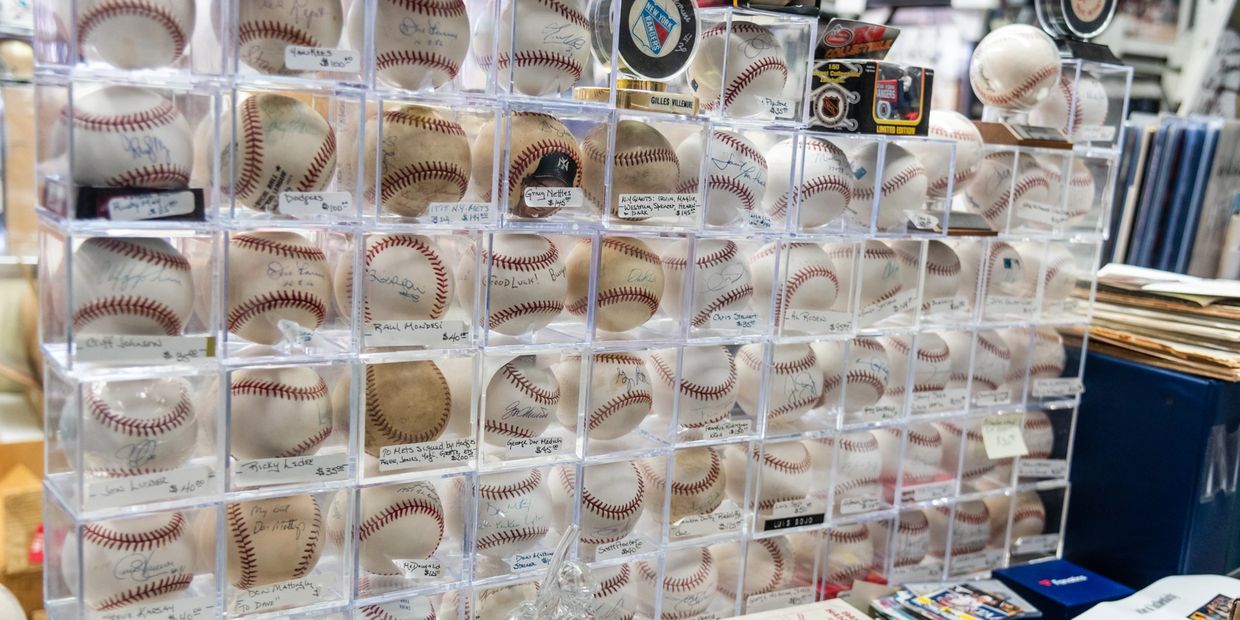 A collection of many different types of baseballs