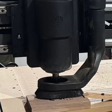 Close-up of a CNC machine working on wood.
