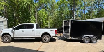 Truck and enclosed trailer used for product delivery.