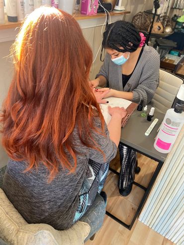 Manicure and red chopper hair