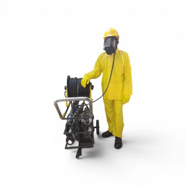 Person in yellow protective suit with equipment on white background.