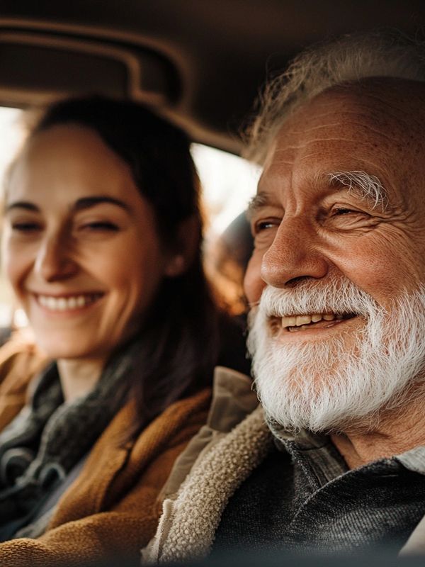 Smiling elderly man and woman enjoying a moment together.