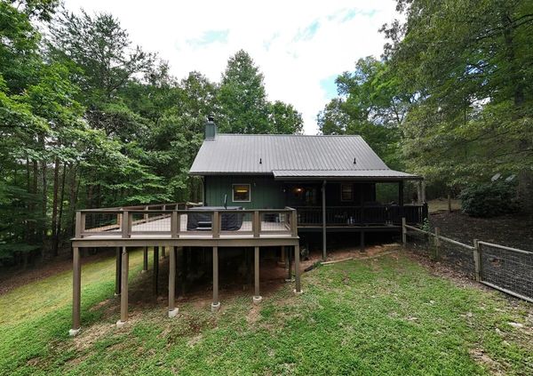 Rear view of wooden cabin and deck