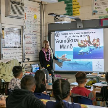 Ocean ramsey teaching at a local school about shark conservation.