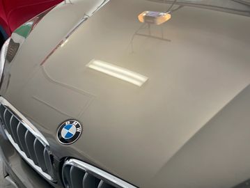 Paint corrected BMW parked next to red car