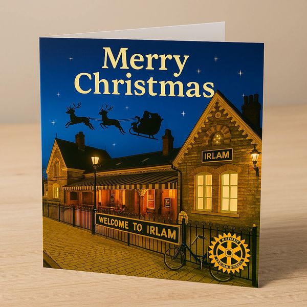 Christmas card showing a festive night scene at Irlam station with Santa's sleigh.