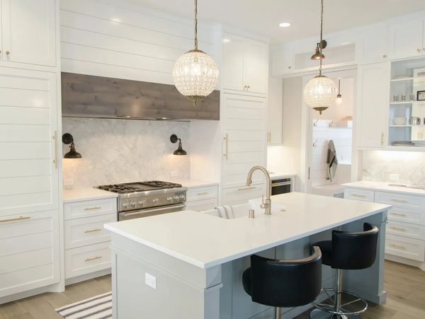 Kitchen with white and gray cabinets satin brass hardware
