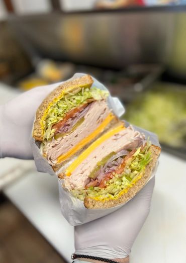 Turkey on sliced sourdough with cheddar cheese