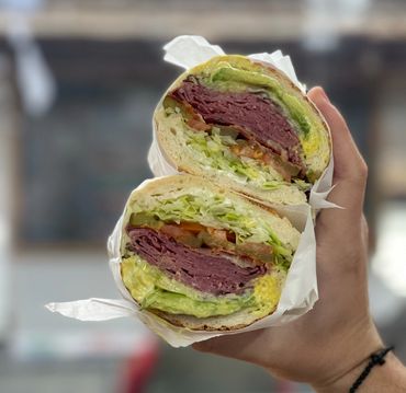 Pastrami, cheese and avocado on dutch crunch bread.