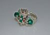 A sterling silver  bead from Bali with red, blue & green coloring is mounted in sterling silver. 2 green Swarovski beads 