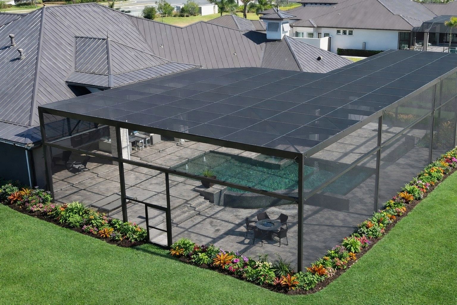 Custom pool enclosure with paver patio, steps, and decorative seating wall surrounded by professiona