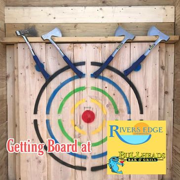 picture of throwing board and axes