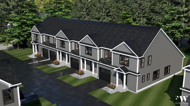 Modern gray townhouse complex with garages and greenery.
