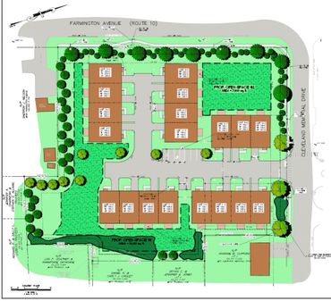 Site plan for a residential development with units, open spaces, and surrounding streets.