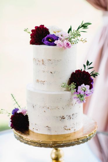 naked wedding cake with burgundy dahlias, purple lisianthus and lavender stock