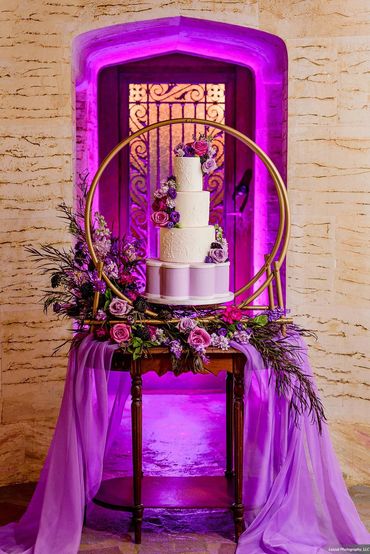 purple and white wedding cake at The Howey Mansion in Central Florida wedding reception