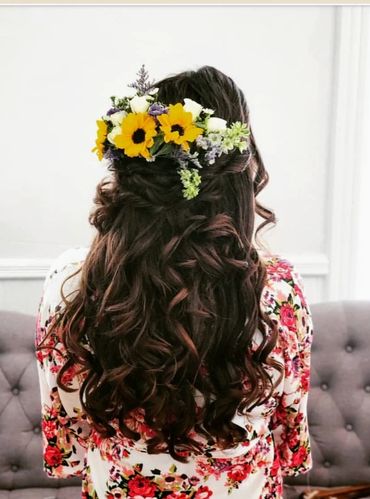 wedding day hair flowers using miniature sunflowers on dark haired bride