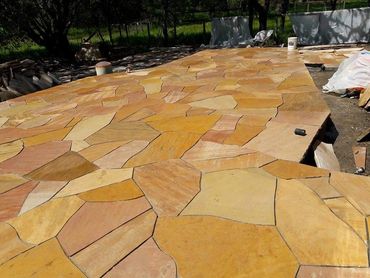 Patio paved in premium Arizona Flagstone showing natural range of golds, tans, and warm oranges.