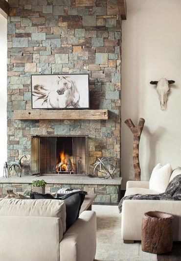 Interior fireplace wall featuring Kent Falls Thin Veneer, a natural stone blend of greys, greens, an