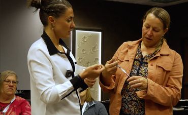 Two women talk ozone therapy training workshop One of the women, Dr. Sarina Barbara.