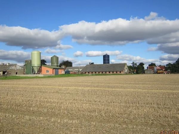 a beautiful village next to a field