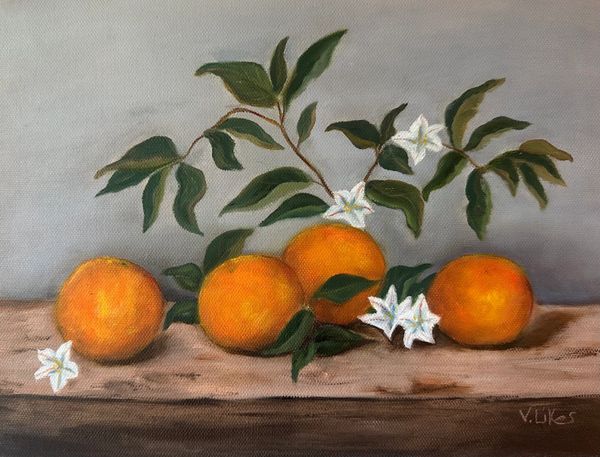 Four tangerines on a board