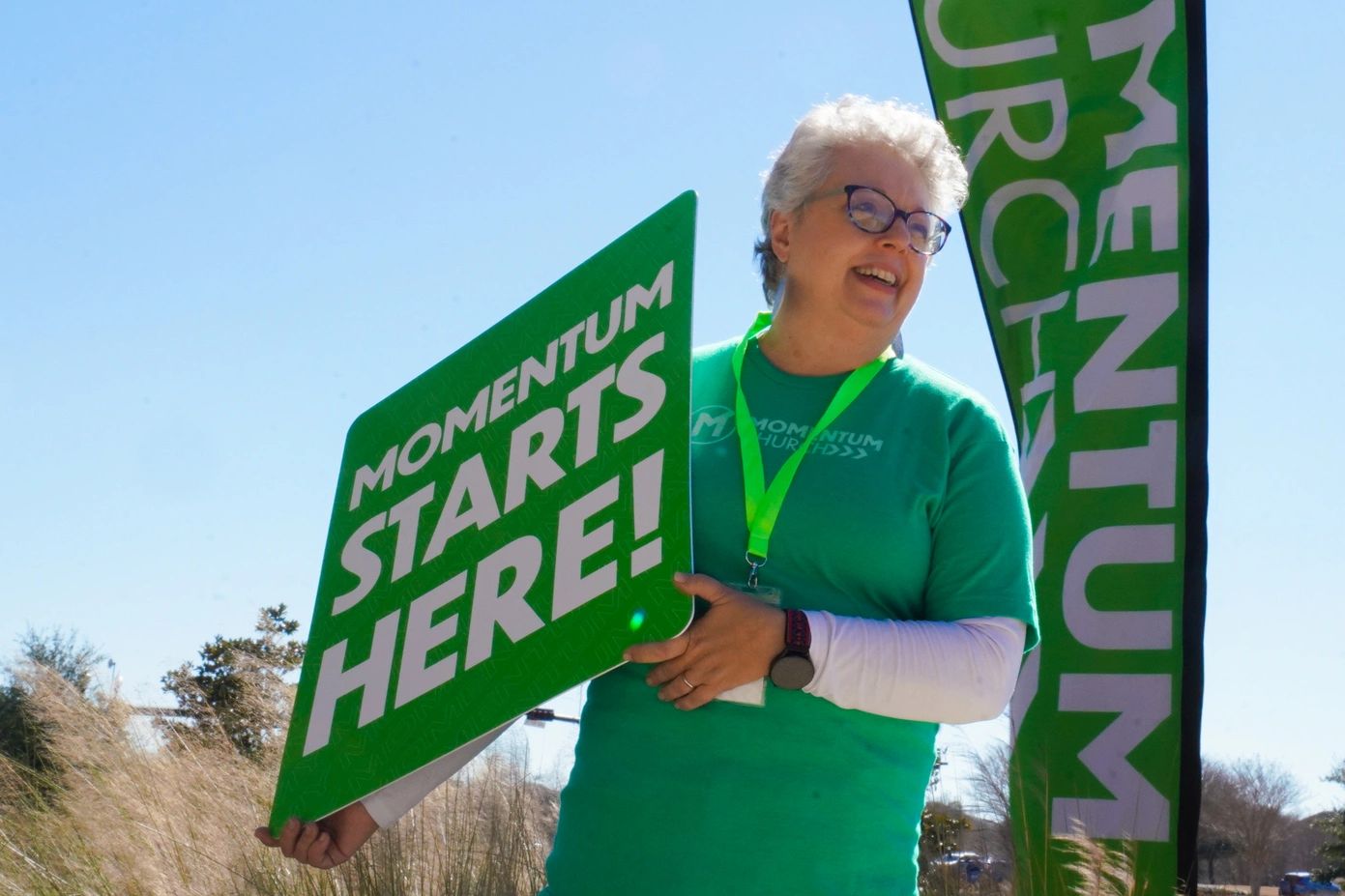 A member of the momentum dream team welcomes guests