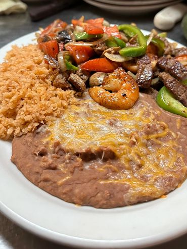 Delicious fajitas Mixtas with Beef, Shrimp, and Chicken