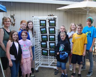 Sherwood artist D. K. Boljat and students with their finished paintings