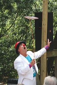 Jef spinning a plate at the Ocrafolk Festival.  Photo by Clayton Gaskill.