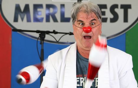 Jef juggling  clubs at Merlefest.  Photo by George Loudon.