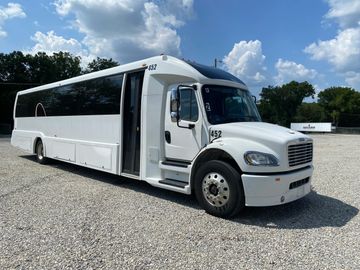 A large and luxurious white bus