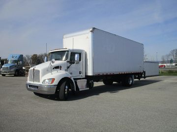A large white hauling truck
