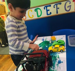 Milestones UWS Preschool - painting with cars for our transportation unit!
