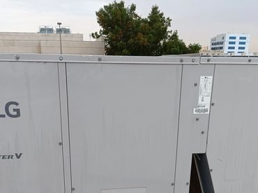 Large LG Inverter V air conditioning unit on rooftop.