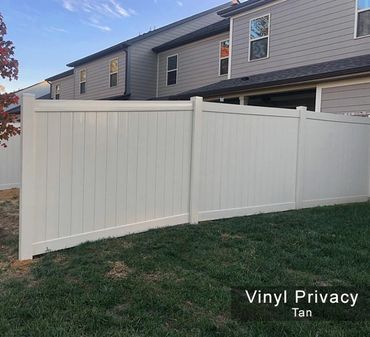 Tan full-privacy vinyl fence