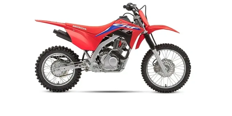 Red Honda dirt bike with knobby tires and sporty design. Honda CRF 250F, Honda CRF 125F