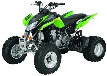 Green and black all-terrain quad bike with rugged tires.